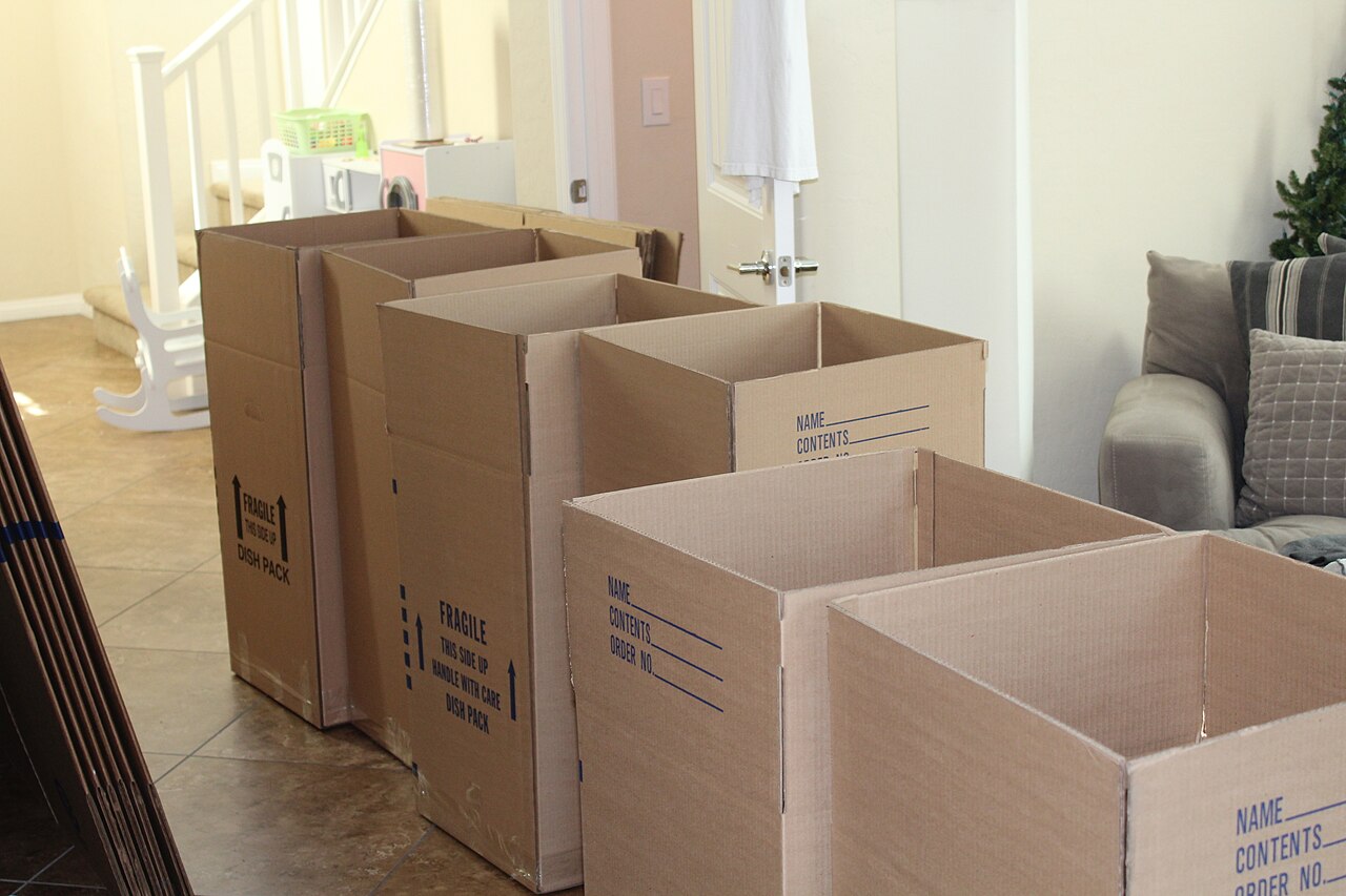 Moving boxes in a home ready for moving day and end of tenancy cleaning